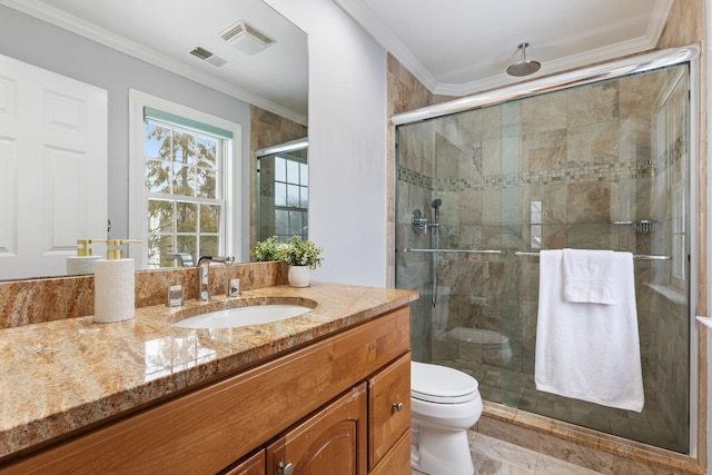 bathroom featuring vanity, a shower with door, ornamental molding, and toilet