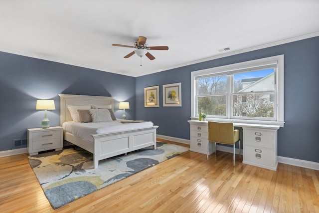 bedroom with crown molding, ceiling fan, and light wood-type flooring