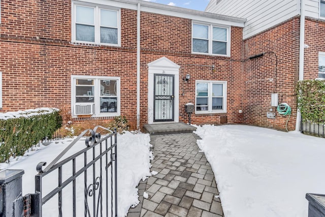 view of snow covered property entrance