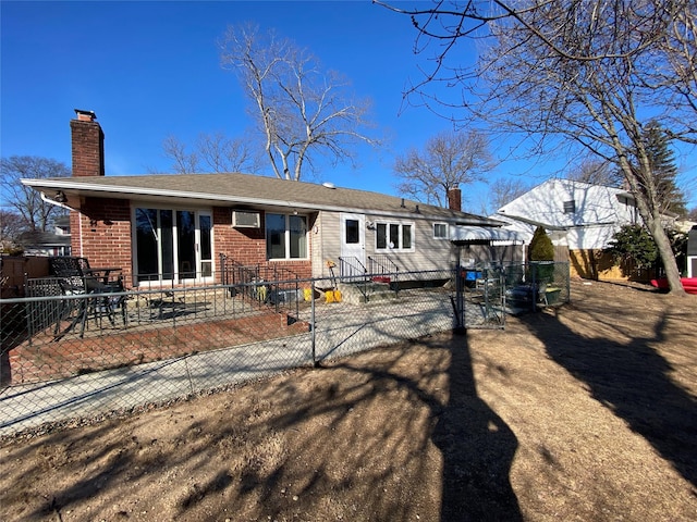 rear view of property featuring a patio