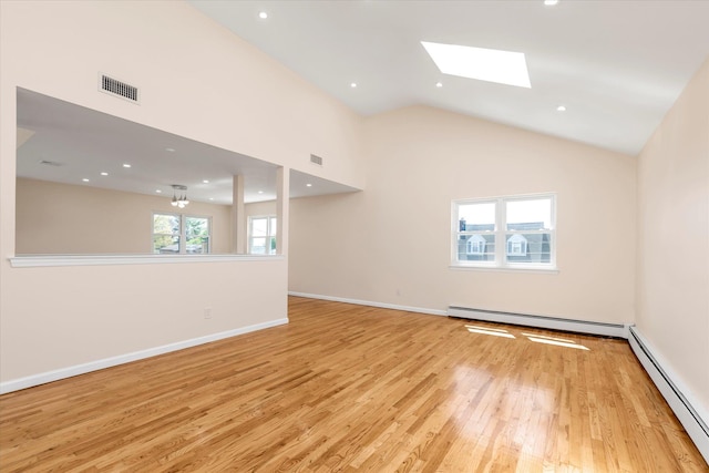 unfurnished living room featuring visible vents, a baseboard radiator, and light wood finished floors
