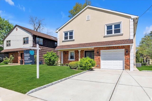 traditional home with a garage, driveway, brick siding, and a front yard