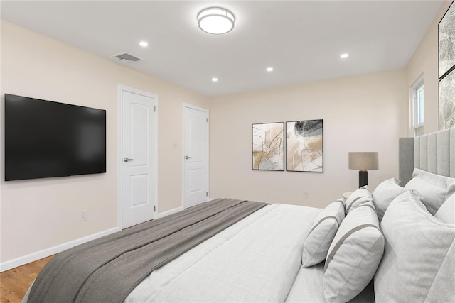 69 Woodward St, Roslyn Heights, NY 11577 - bedroom featuring wood finished floors, baseboards, visible vents, and recessed lighting