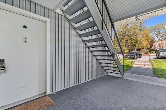 property entrance featuring board and batten siding