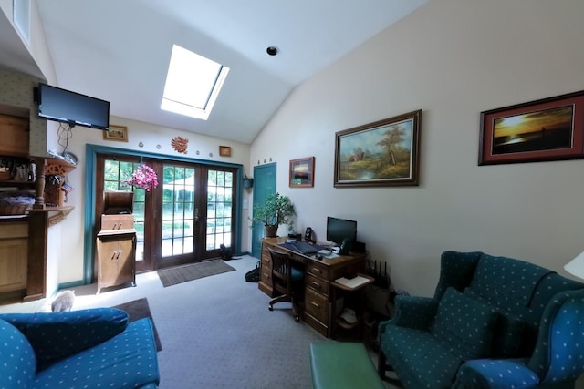 carpeted office with french doors and lofted ceiling with skylight