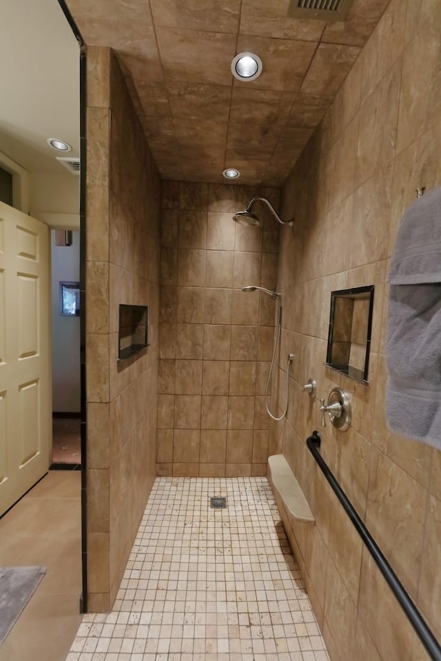 full bath with tiled shower, tile patterned flooring, and recessed lighting