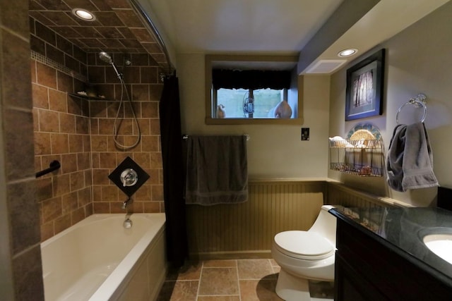 bathroom with shower / bathtub combination, toilet, recessed lighting, vanity, and wainscoting