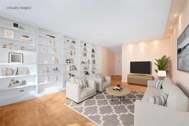 living room with parquet floors and built in shelves