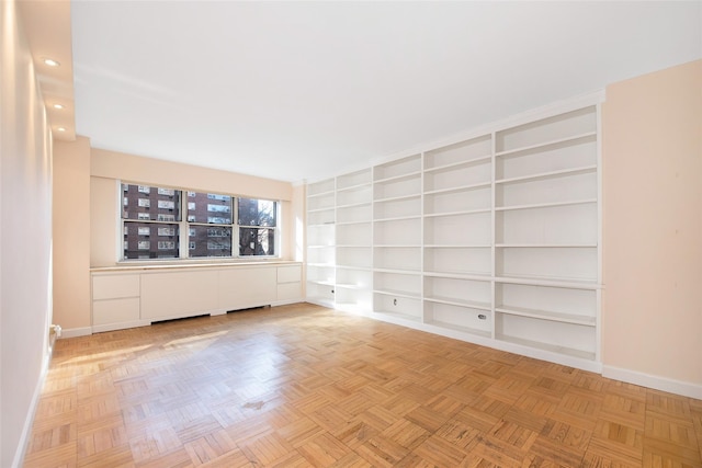 spare room featuring parquet floors