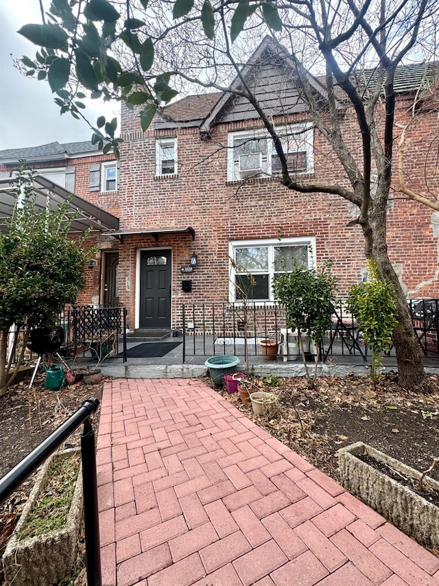 view of front of home with brick siding