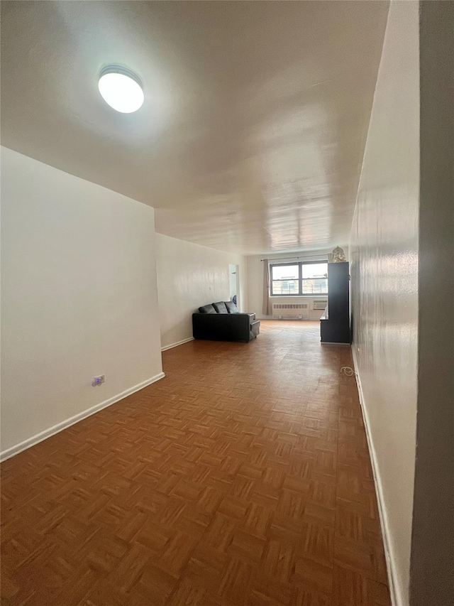 interior space with radiator and dark parquet floors