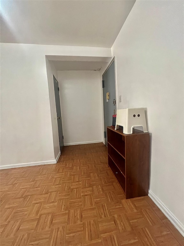 corridor with light parquet floors