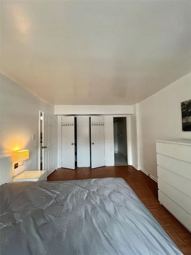 unfurnished bedroom with parquet floors