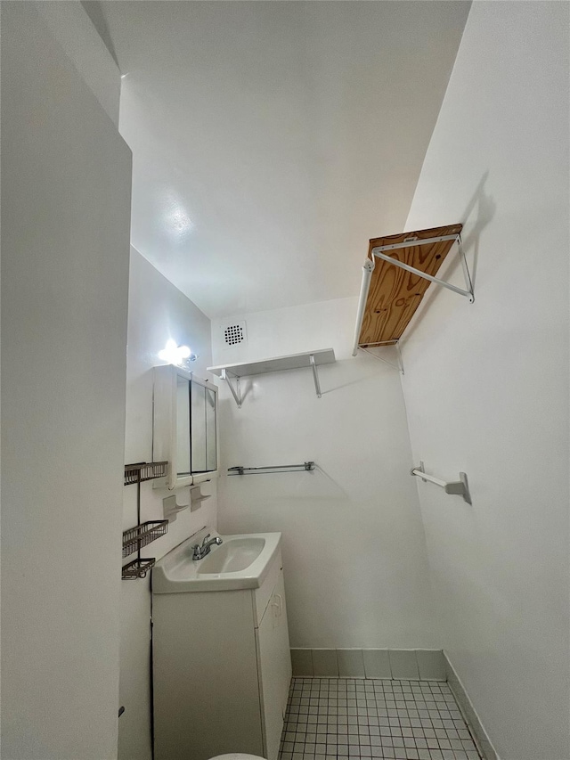 bathroom with vanity and tile patterned flooring