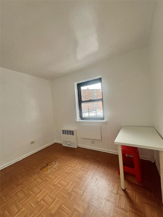 additional living space with light parquet floors