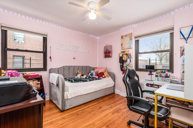 bedroom featuring ceiling fan and light hardwood / wood-style floors