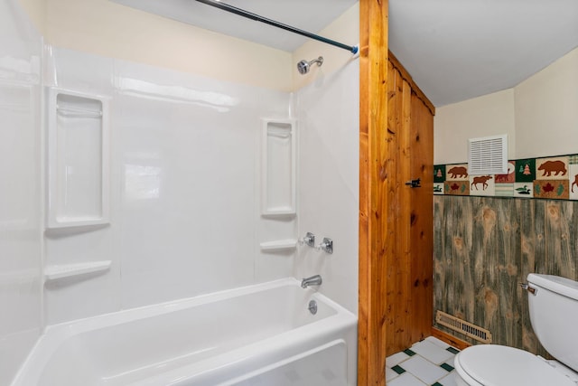 bathroom featuring shower / bathing tub combination and toilet