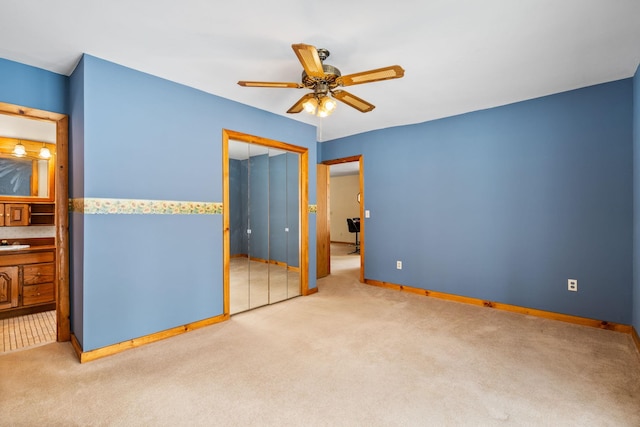 unfurnished bedroom with ceiling fan, carpet floors, and a closet