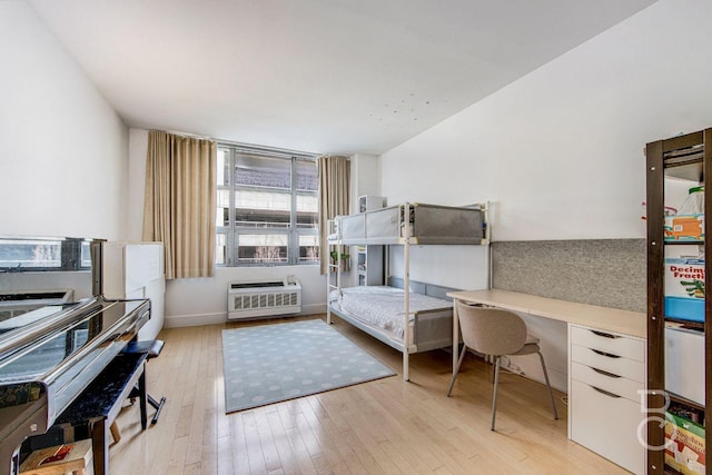 bedroom with light hardwood / wood-style flooring