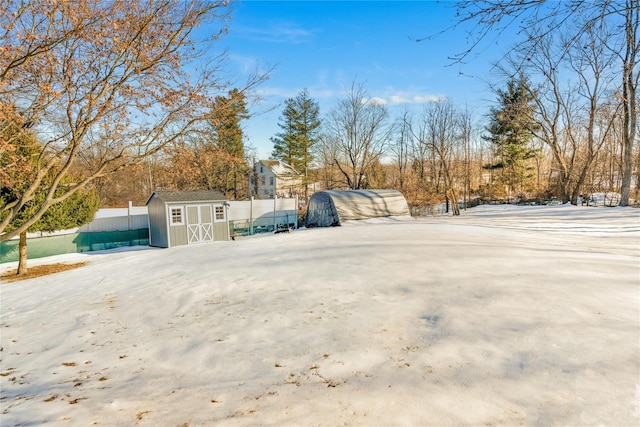 view of snow covered parking area