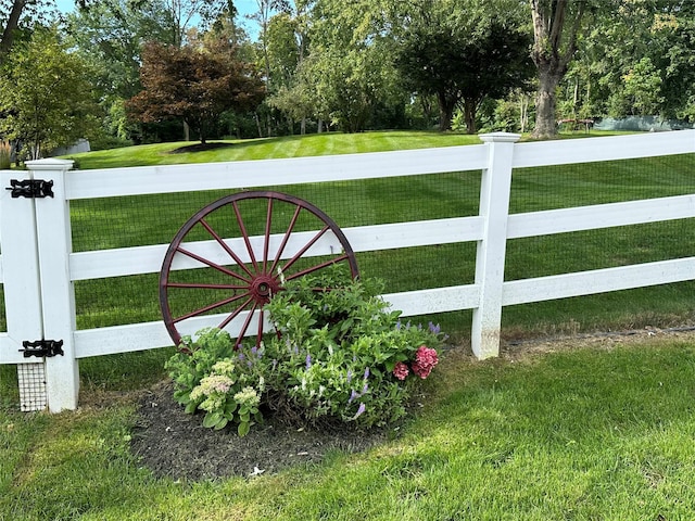 view of gate featuring a yard