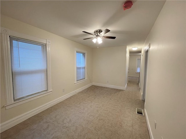 empty room featuring ceiling fan