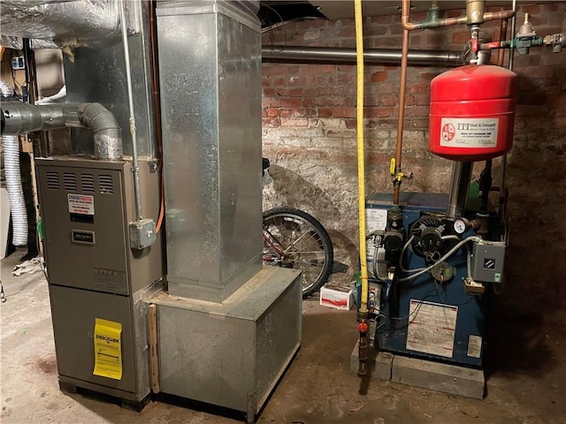 utility room featuring heating unit