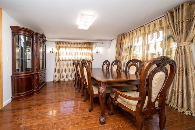 dining space featuring dark hardwood / wood-style floors