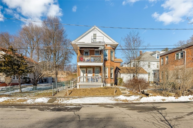 view of front of home with a balcony and a porch