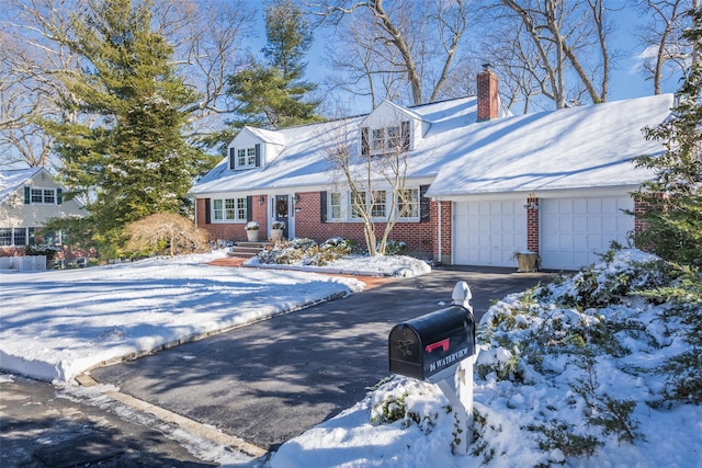 cape cod house featuring a garage