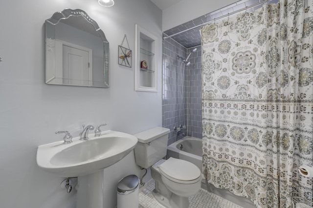 bathroom with shower / tub combo with curtain, tile patterned floors, and toilet