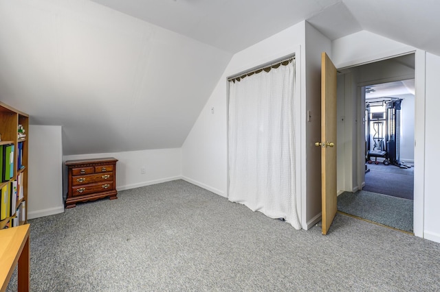 bonus room featuring lofted ceiling and carpet floors