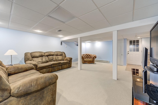 living room featuring a baseboard radiator, carpet, and a paneled ceiling