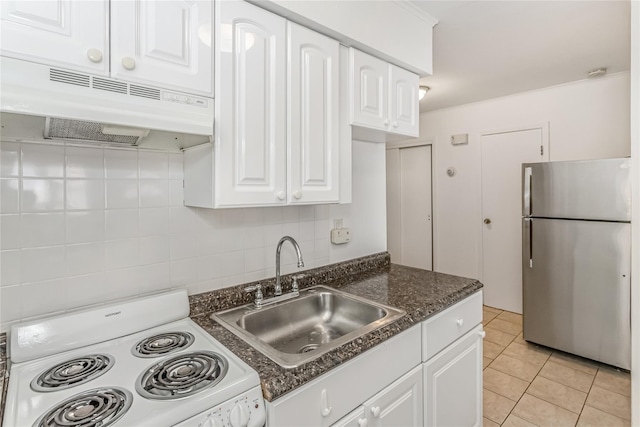 kitchen with light tile patterned flooring, white electric range, stainless steel refrigerator, sink, and white cabinets