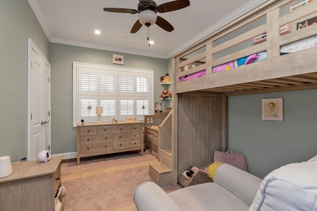 bedroom with light carpet, ornamental molding, a ceiling fan, and baseboards