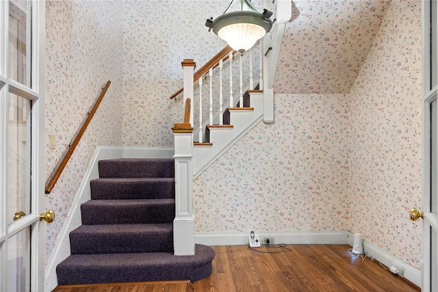 stairway featuring hardwood / wood-style flooring