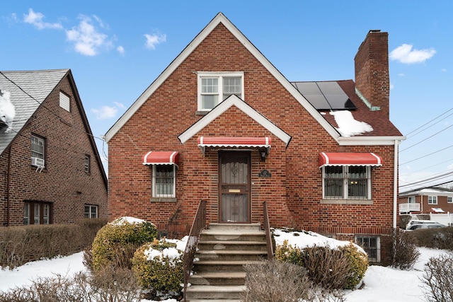 view of front of property with solar panels