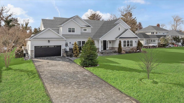 view of front facade with a garage and a front lawn