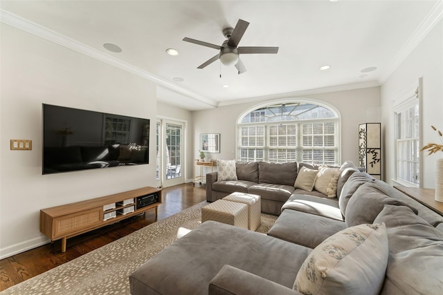 living room with dark wood-style floors, ornamental molding, baseboards, and ceiling fan