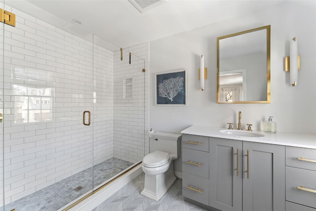 bathroom with toilet, a stall shower, vanity, and visible vents