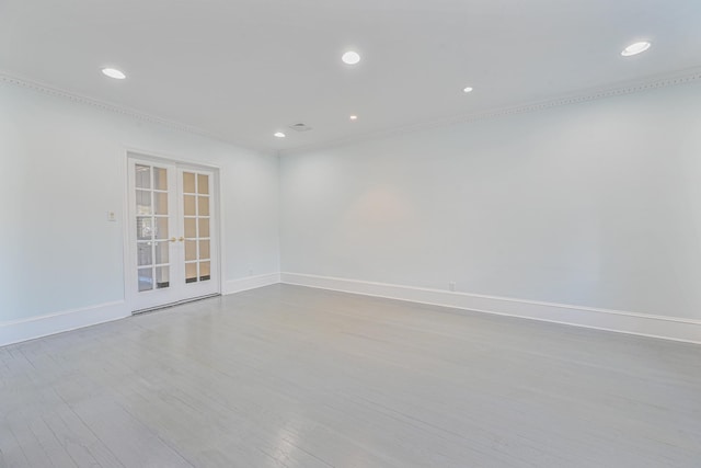 182-61 Avon Rd, Jamaica Estates, NY 11432 - spare room with crown molding, light wood-type flooring, and french doors