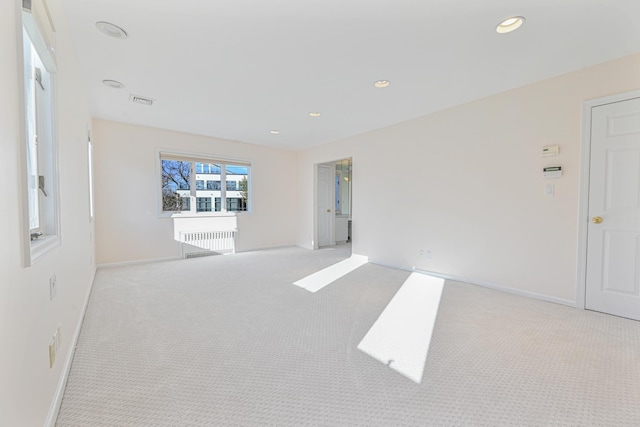 182-61 Avon Rd, Jamaica Estates, NY 11432 - carpeted spare room featuring radiator