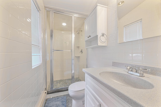 182-61 Avon Rd, Jamaica Estates, NY 11432 - bathroom featuring tile walls, vanity, a shower with door, and toilet