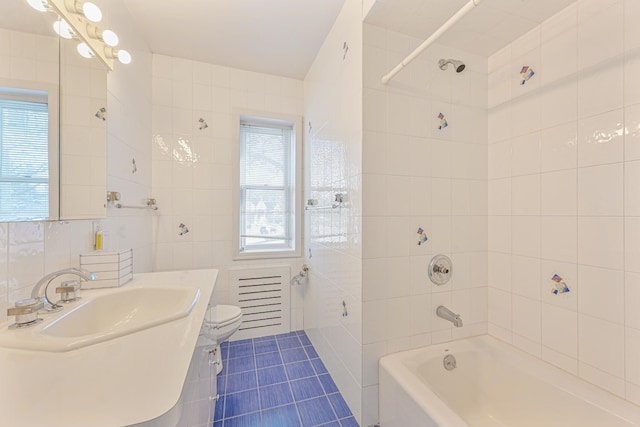 182-61 Avon Rd, Jamaica Estates, NY 11432 - full bathroom featuring tile patterned floors, toilet, tile walls, vanity, and tiled shower / bath combo