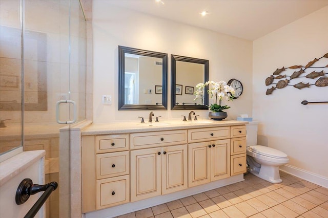 full bathroom featuring a stall shower, a sink, toilet, and double vanity