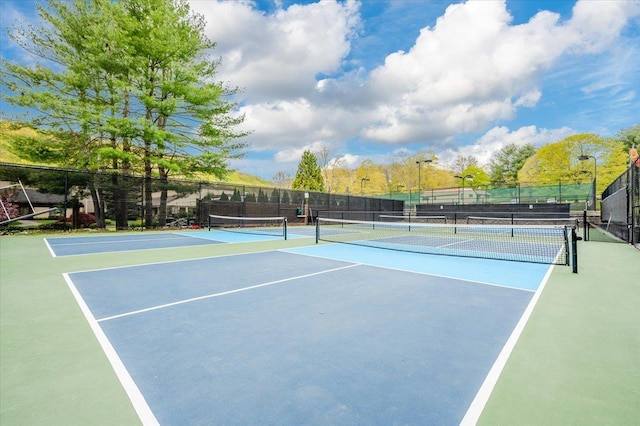 view of sport court with fence