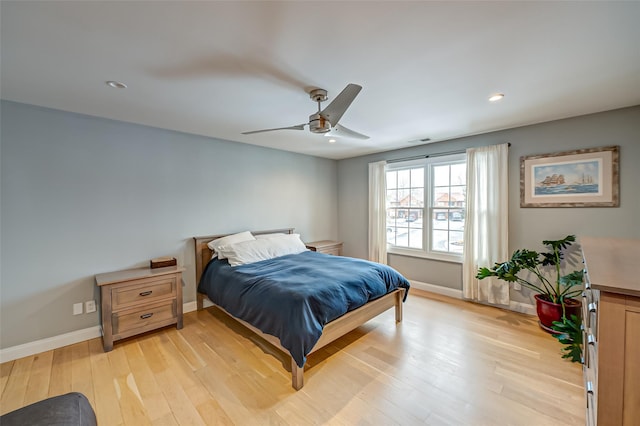 bedroom with light wood finished floors, ceiling fan, baseboards, and recessed lighting