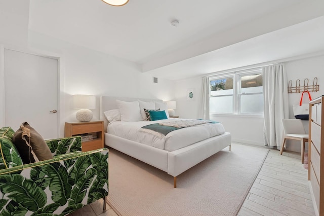 bedroom featuring light wood-style flooring