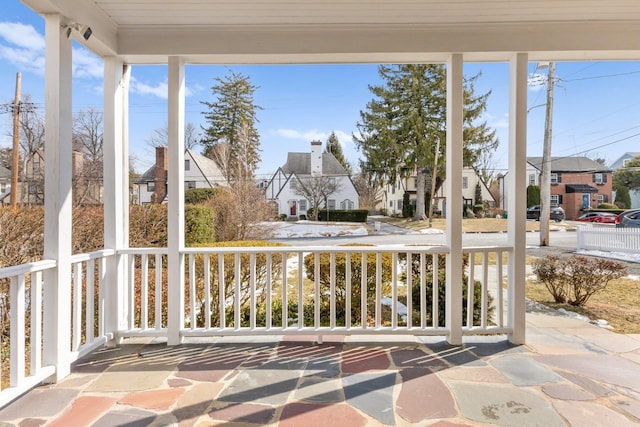 unfurnished sunroom with a residential view