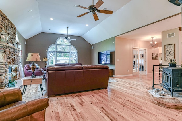 34 Clark Ln, Harriman, NY 10926 - living area with ceiling fan, light wood-style floors, a wood stove, lofted ceiling, and a chandelier